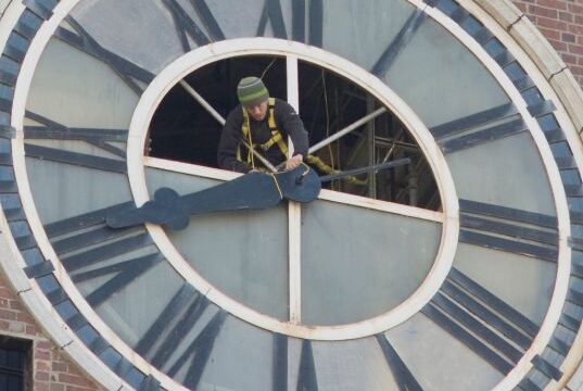 STation fixing the king street station clock